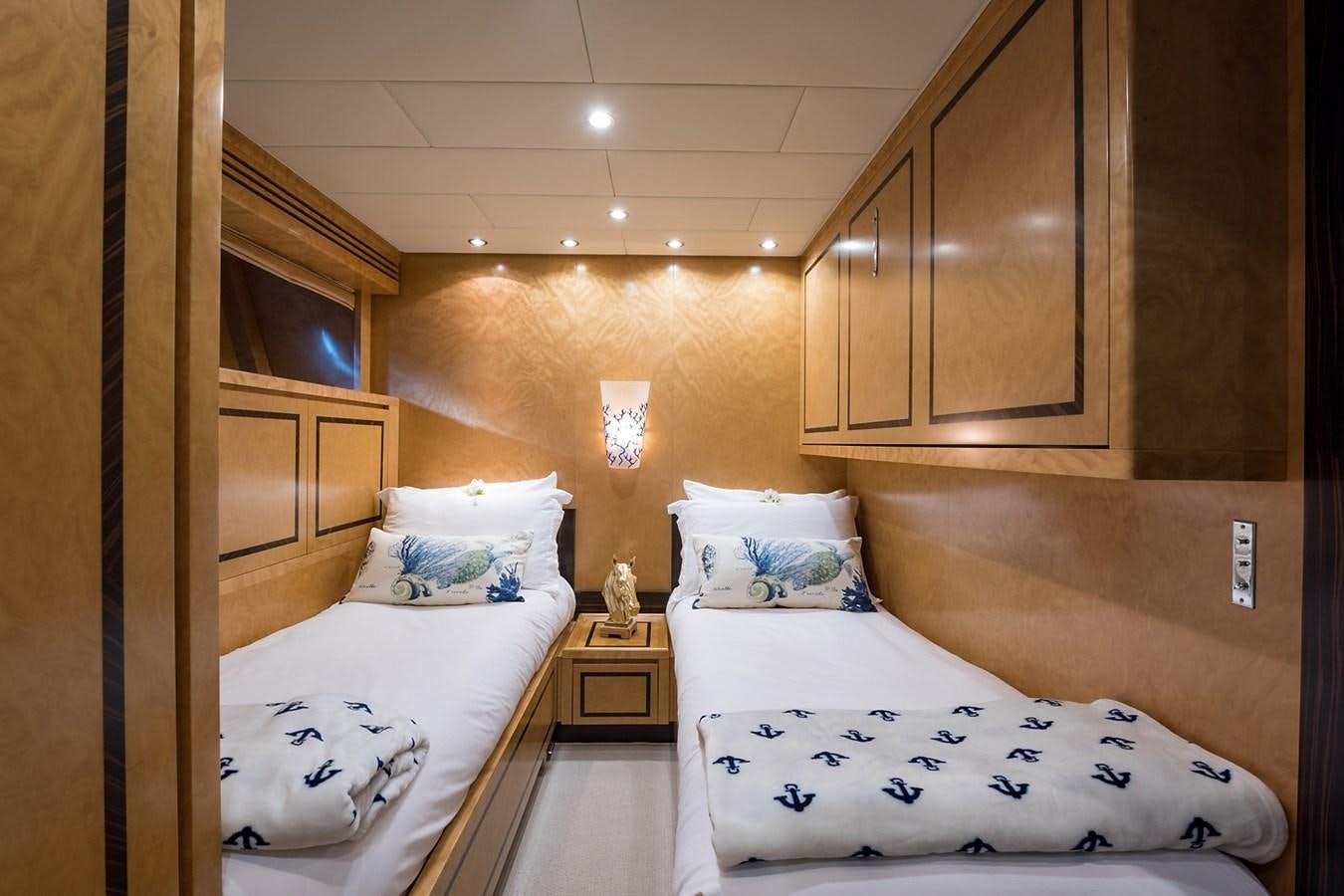 a room with two beds aboard 34M LEOPARD Yacht for Sale