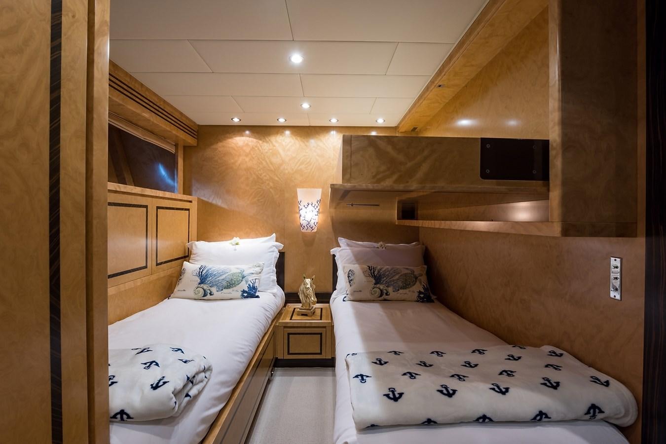a room with two beds aboard 34M LEOPARD Yacht for Sale