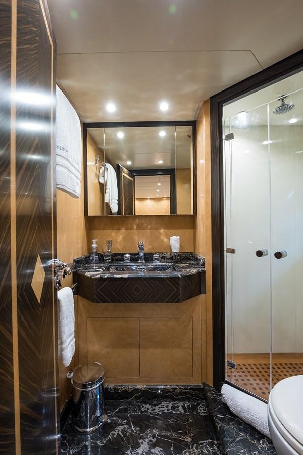 a bathroom with a large mirror aboard 34M LEOPARD Yacht for Sale