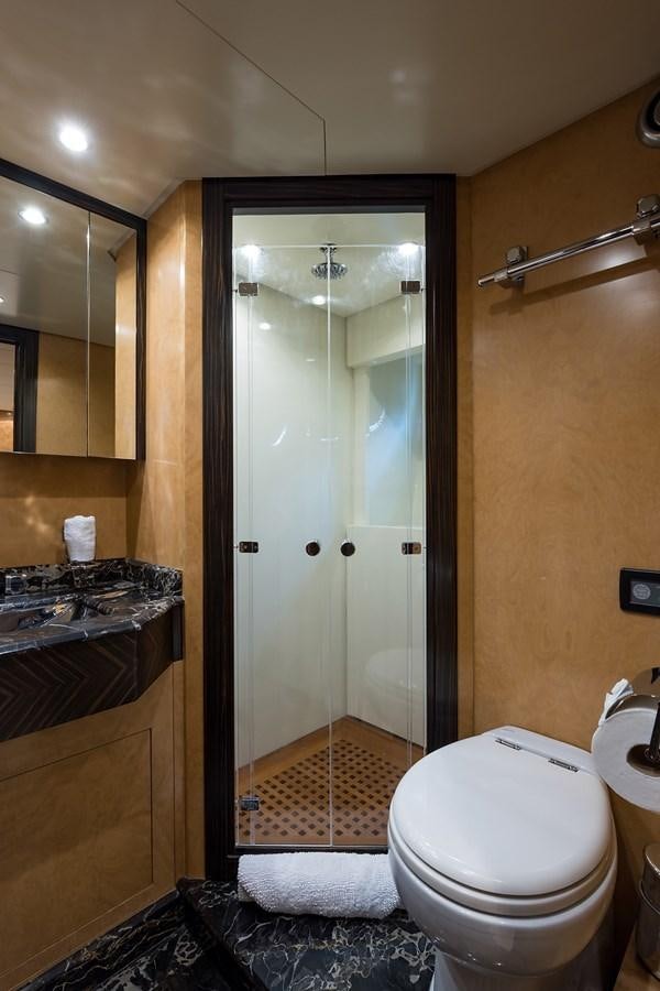 a bathroom with a glass shower door aboard 34M LEOPARD Yacht for Sale