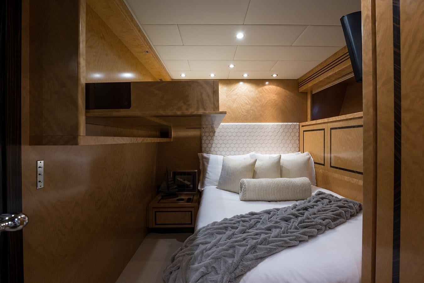 a room with a bed and a wood wall aboard 34M LEOPARD Yacht for Sale