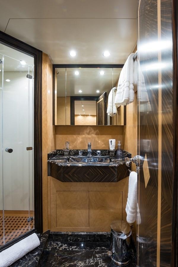 a bathroom with a sink and a shower aboard 34M LEOPARD Yacht for Sale