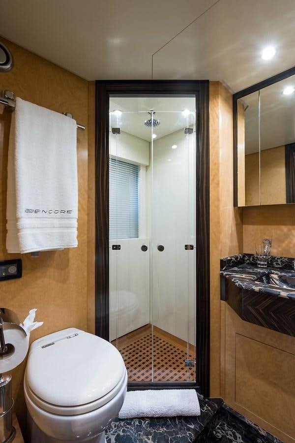 a bathroom with a glass shower door aboard 34M LEOPARD Yacht for Sale