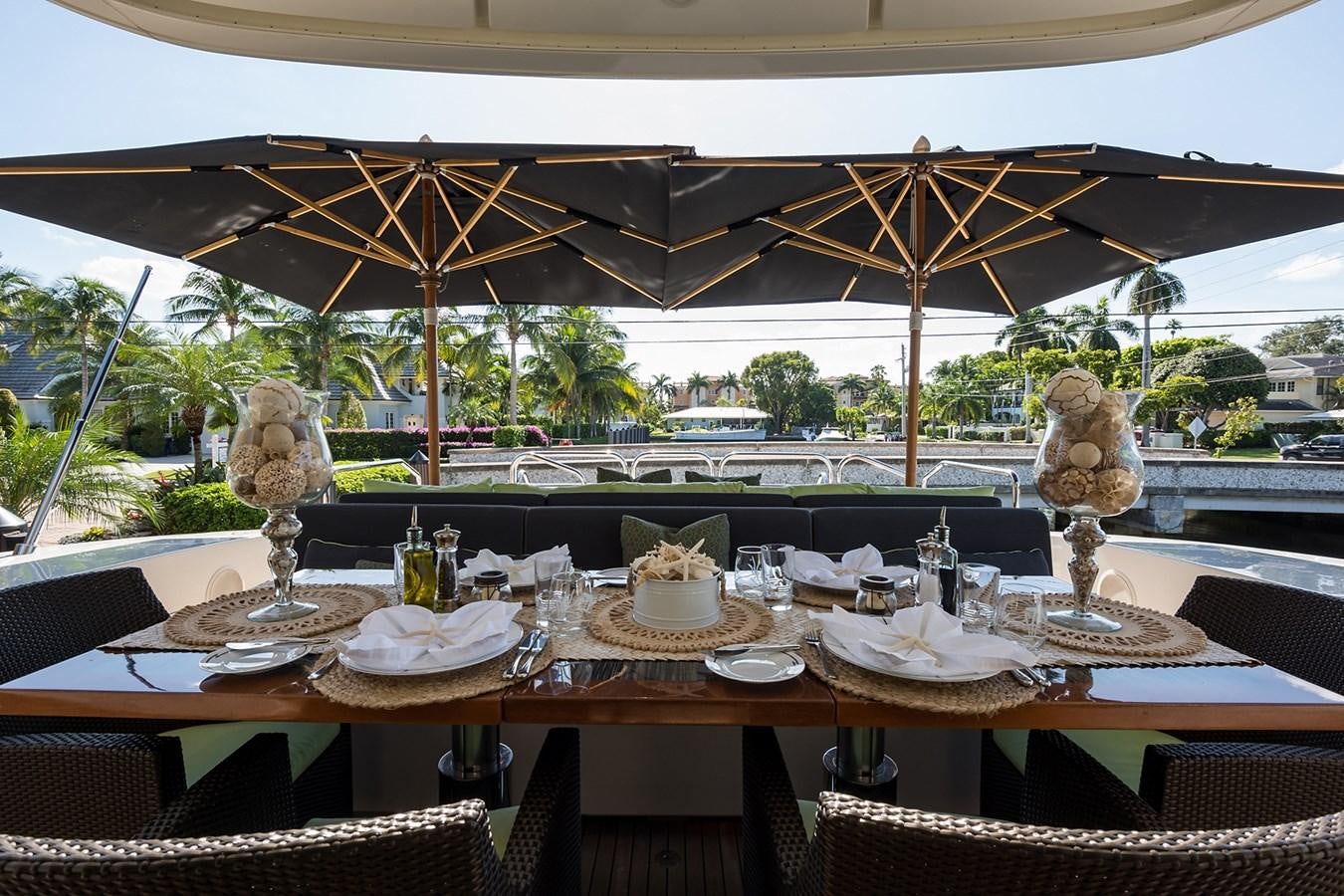 a table with food and a statue aboard 34M LEOPARD Yacht for Sale