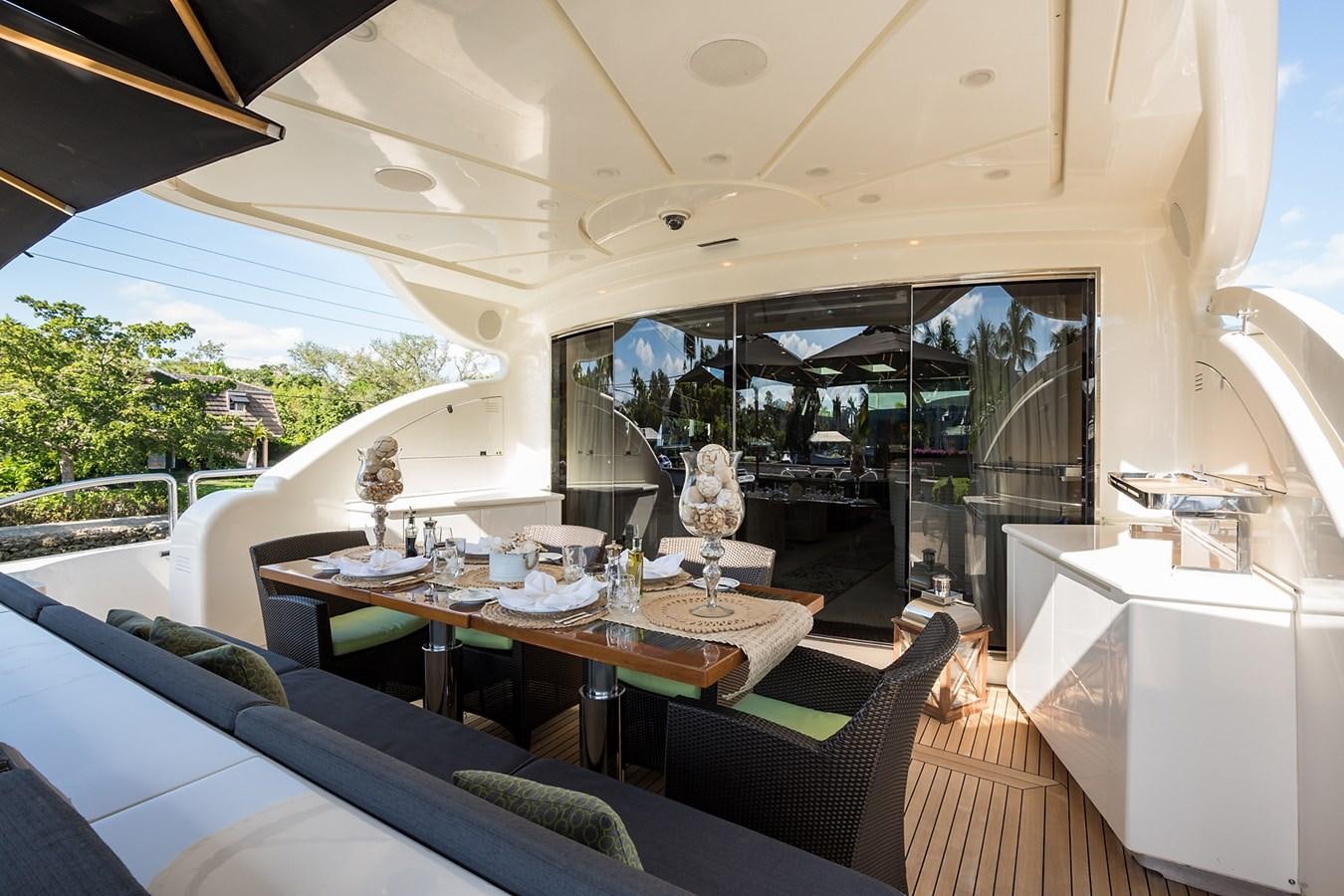 a dining room with a large window aboard 34M LEOPARD Yacht for Sale