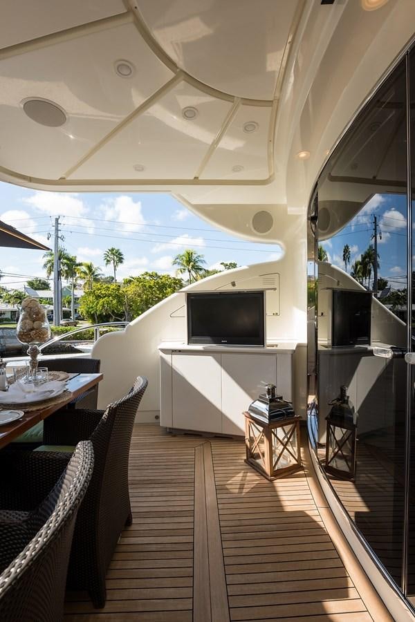 a room with a tv and furniture aboard 34M LEOPARD Yacht for Sale