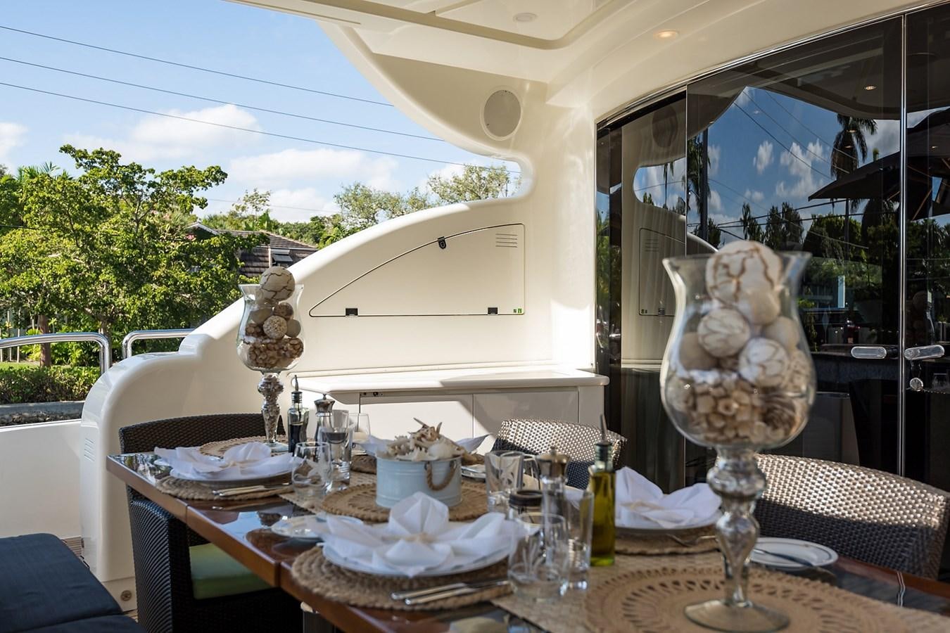 a table with food and drinks on it aboard 34M LEOPARD Yacht for Sale