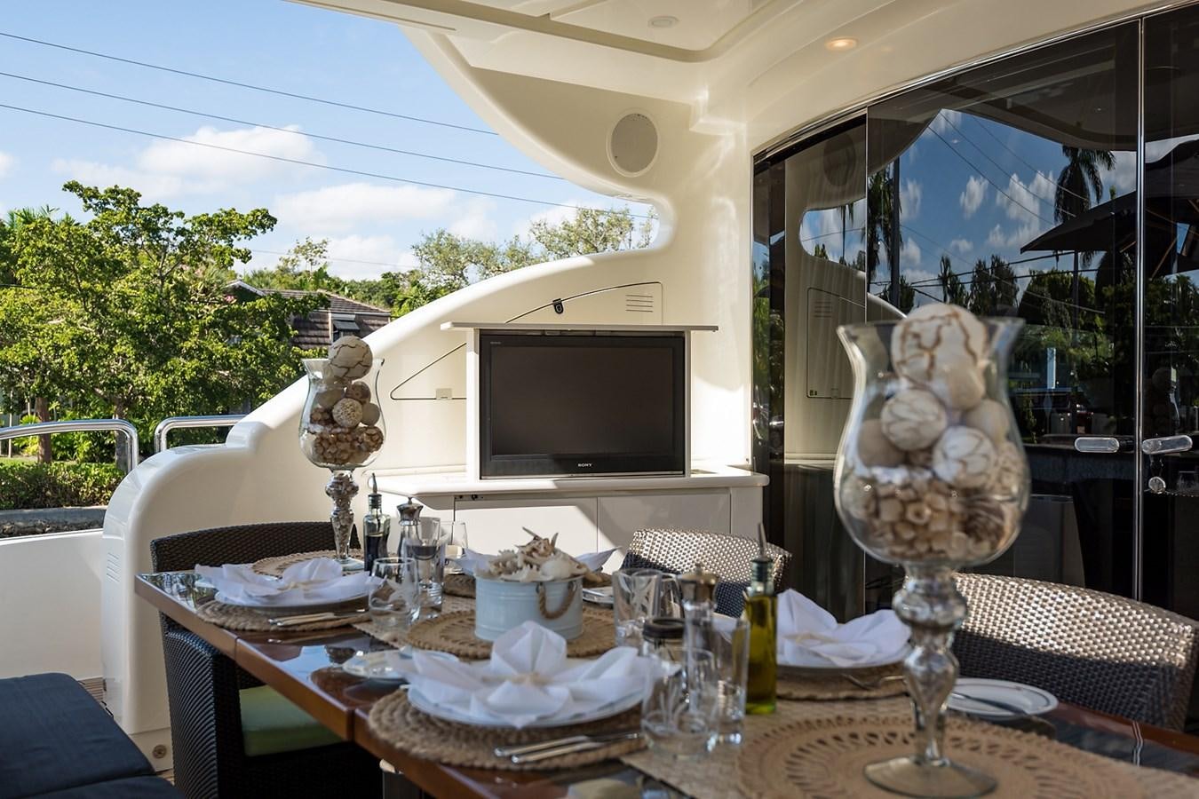 a table with a glass and a skull on it aboard 34M LEOPARD Yacht for Sale