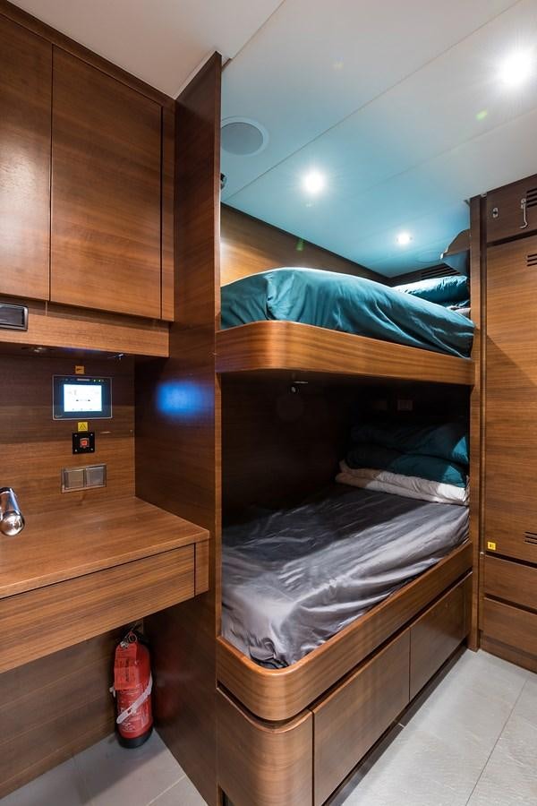 a bunk bed with a red shoe aboard 34M LEOPARD Yacht for Sale