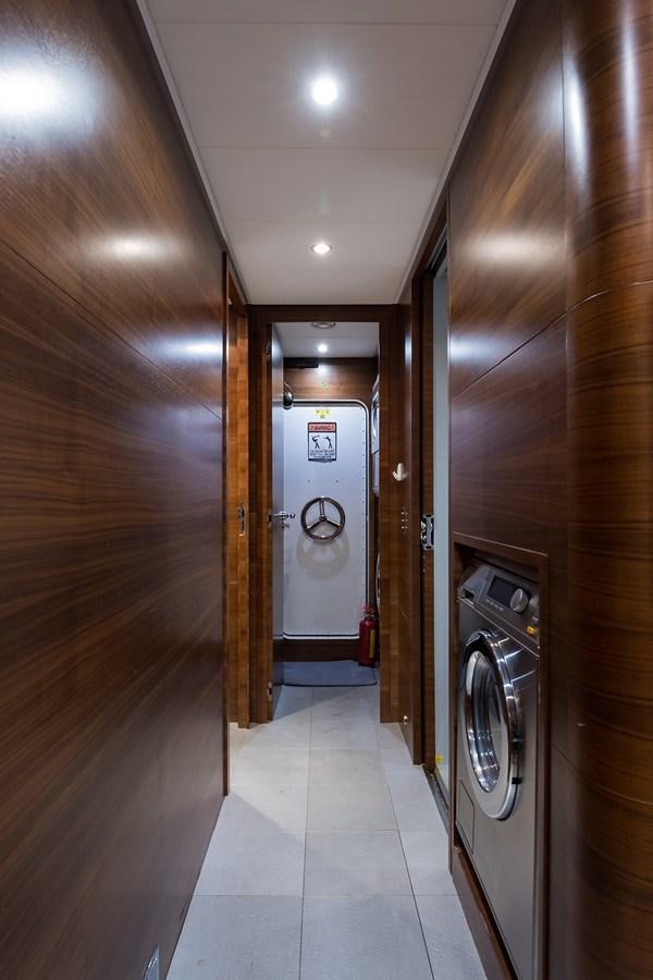 a hallway with a washing machine aboard 34M LEOPARD Yacht for Sale