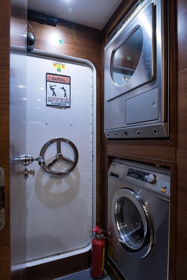 a washer and dryer in a room aboard 34M LEOPARD Yacht for Sale