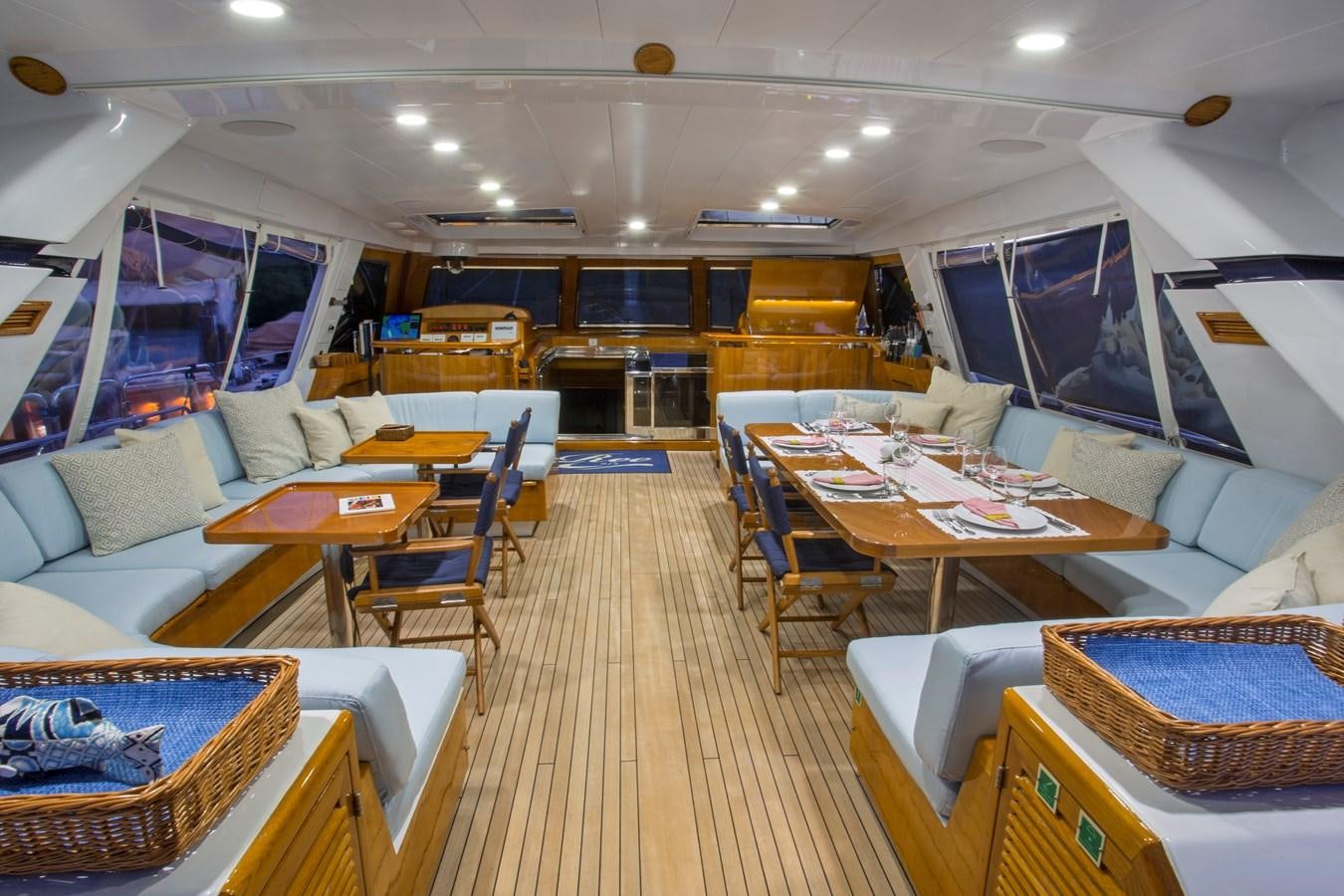 a room with a couch and a table and chairs aboard REE Yacht for Charter