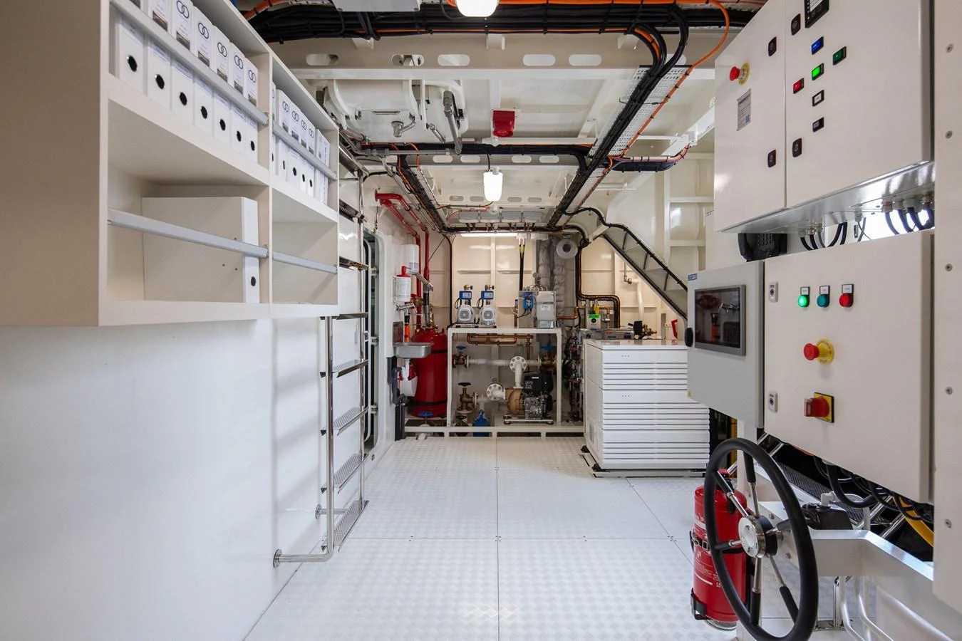 a room with white walls and white walls and a red bike aboard MOONEN 110 MUSTIQUE Yacht for Sale