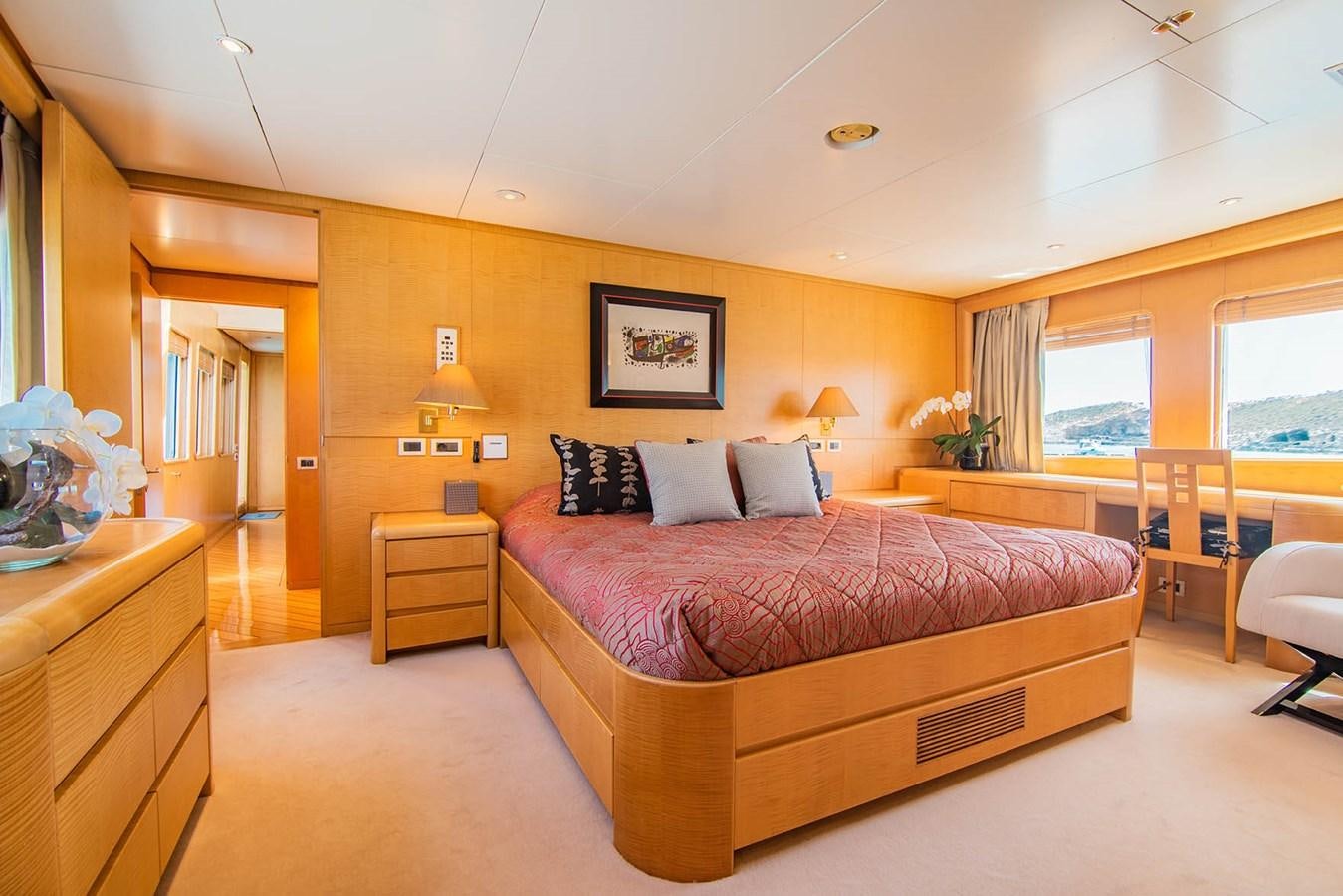 a large bedroom with a bed aboard CRISS C Yacht for Sale
