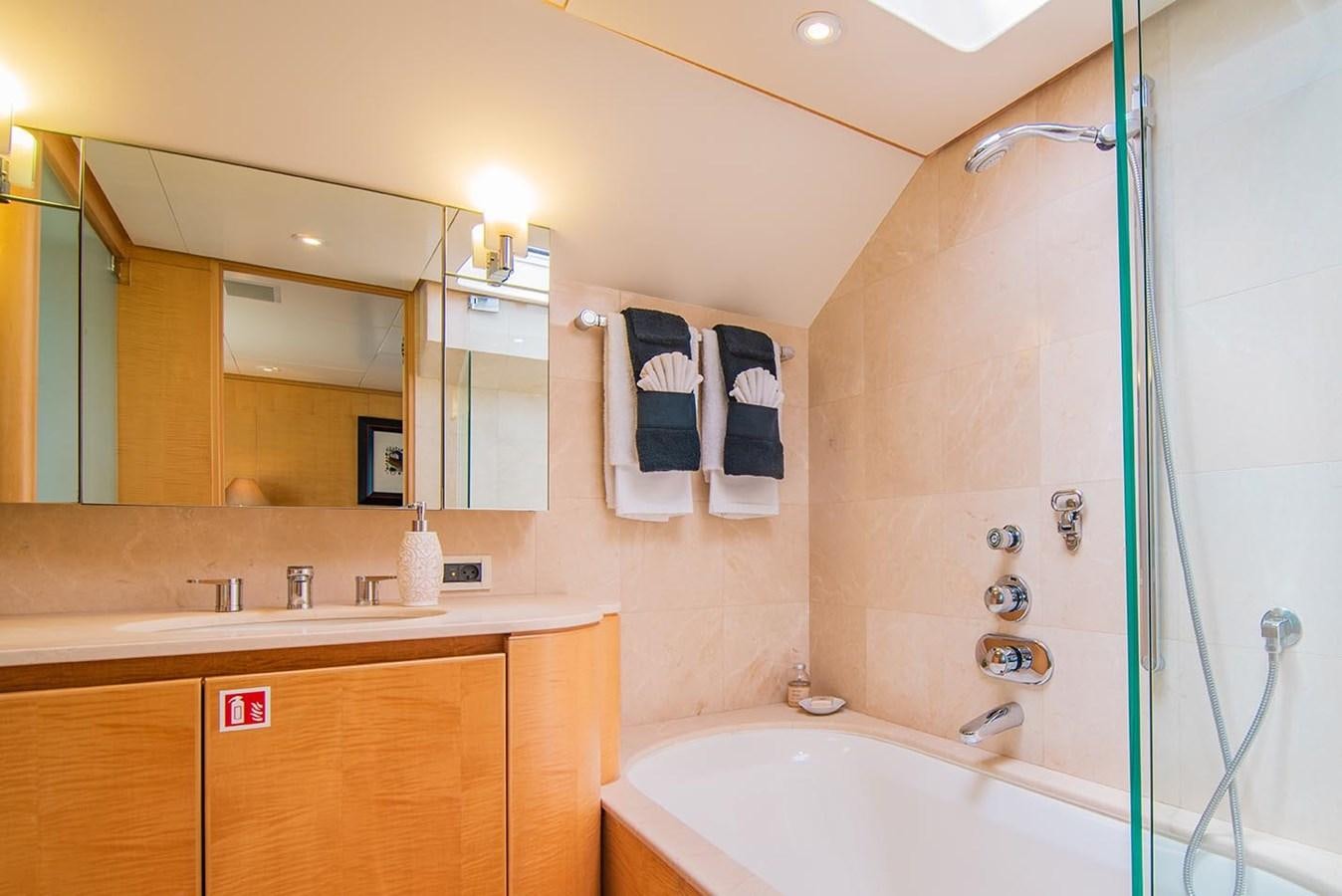 a bathroom with a shower and sink aboard CRISS C Yacht for Sale