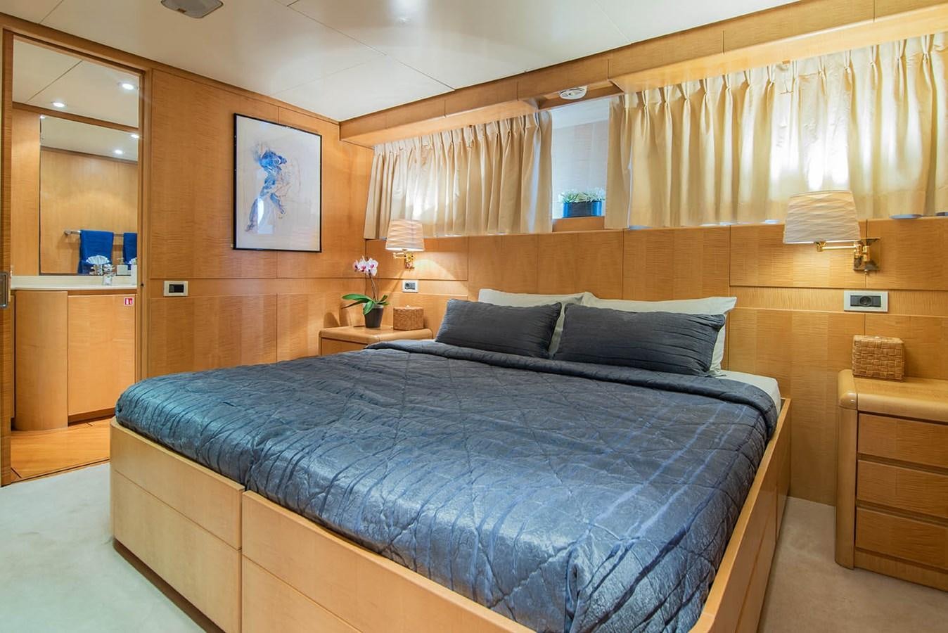 a bed in a room aboard CRISS C Yacht for Sale