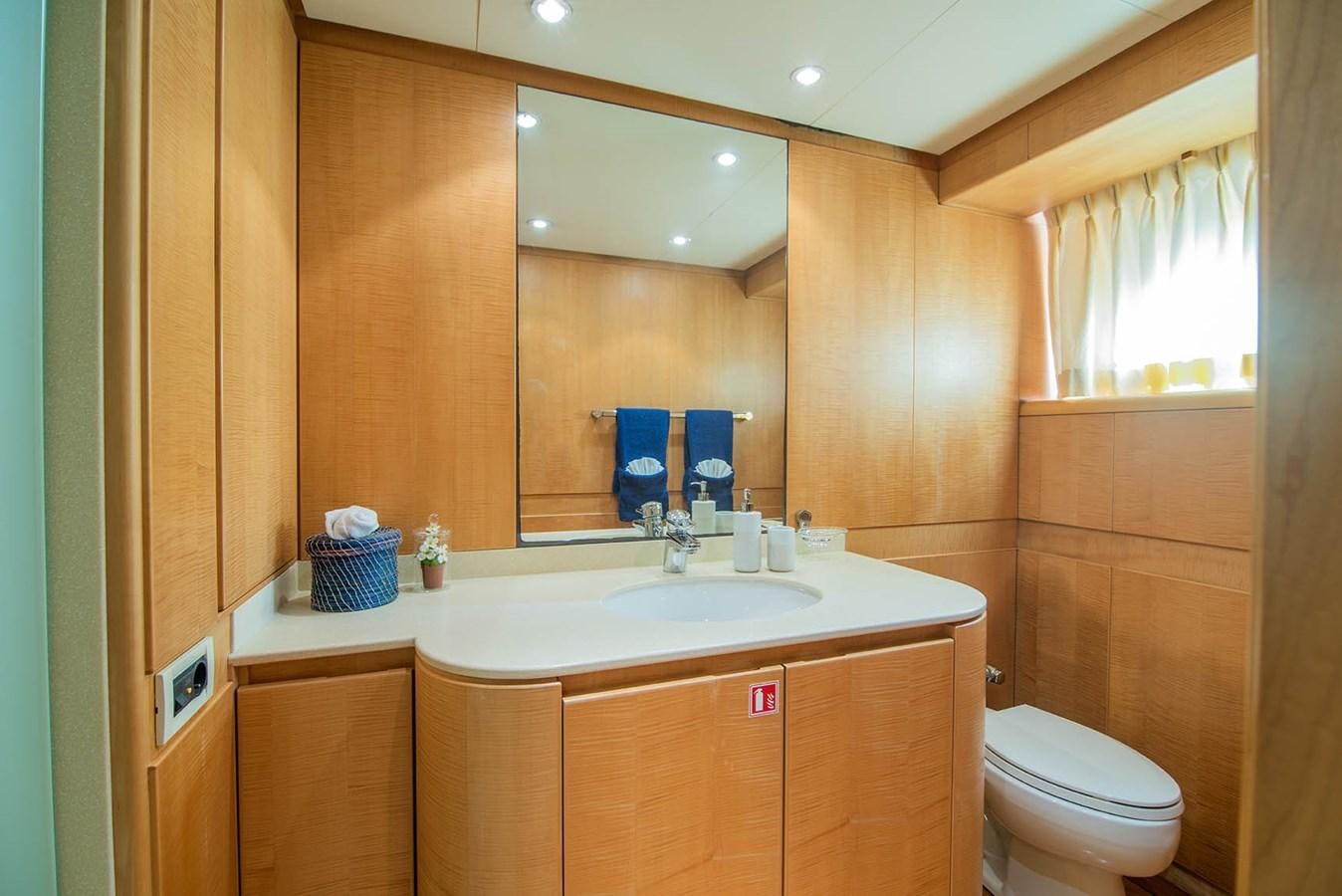 a bathroom with a large mirror aboard CRISS C Yacht for Sale