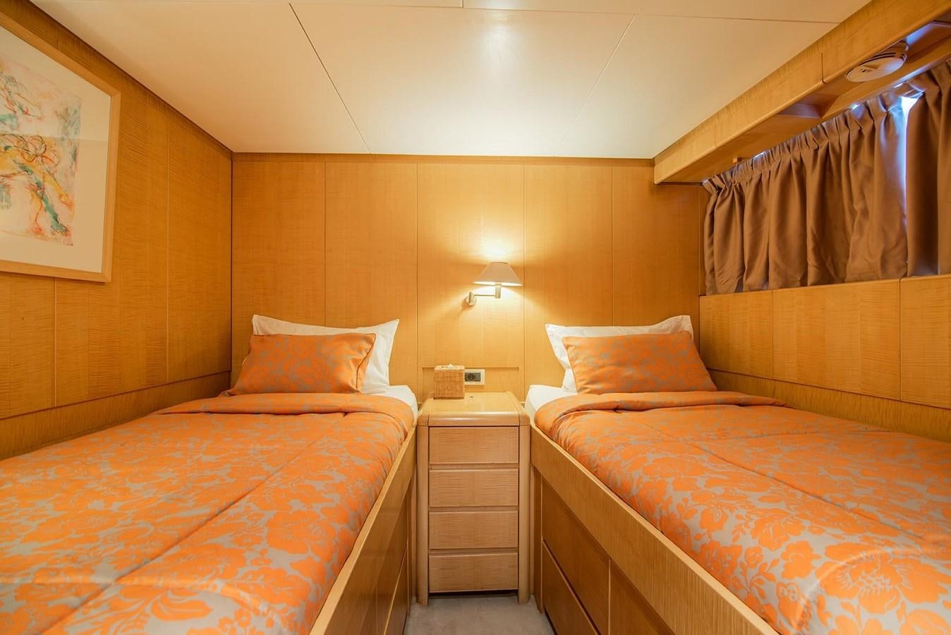 a room with two beds aboard CRISS C Yacht for Sale
