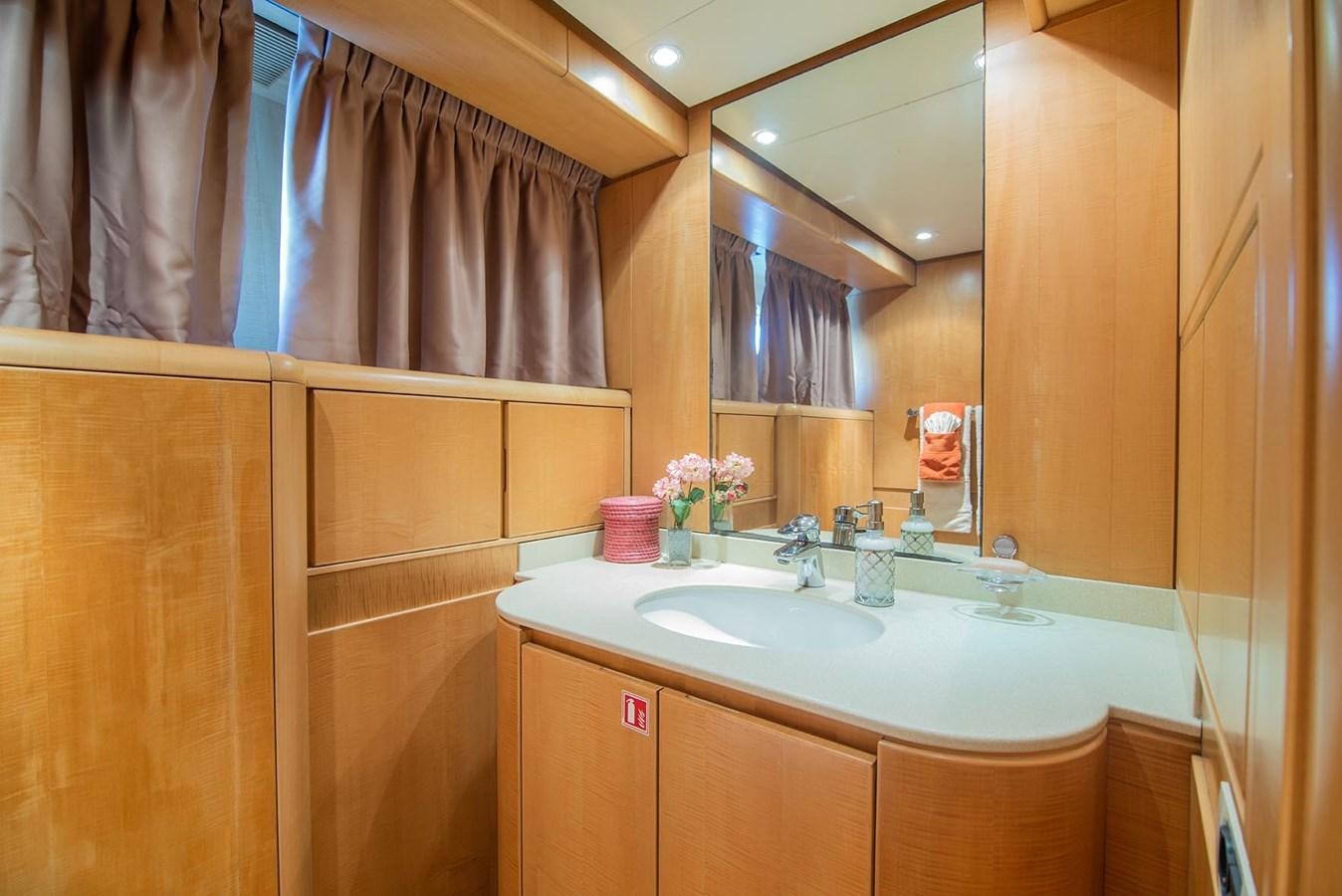 a bathroom with a large mirror aboard CRISS C Yacht for Sale