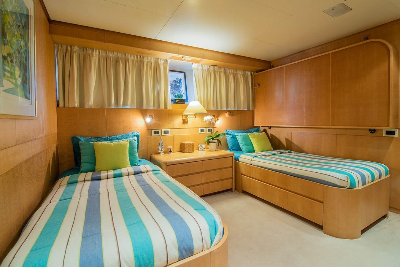 a room with a couple beds aboard CRISS C Yacht for Sale