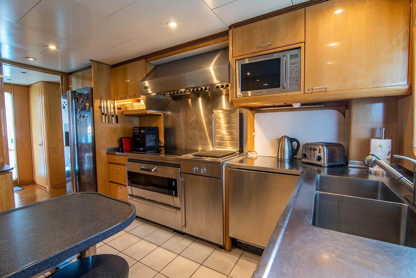 a kitchen with stainless steel appliances aboard CRISS C Yacht for Sale