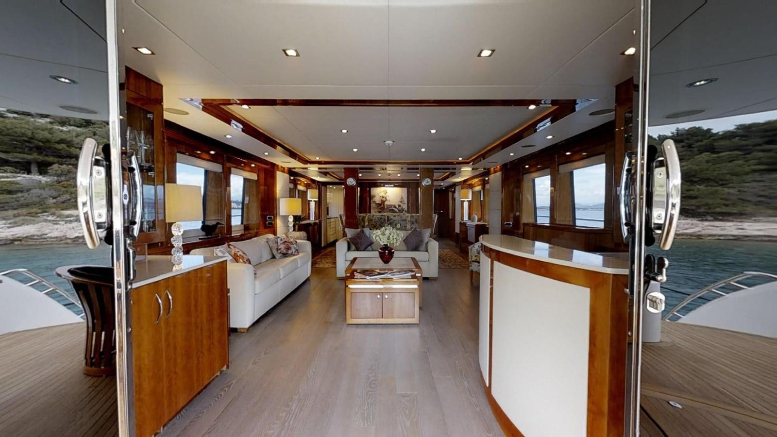 a room with a wood floor and a large window with a view of the water and the outside aboard WHITE PEARL I Yacht for Sale