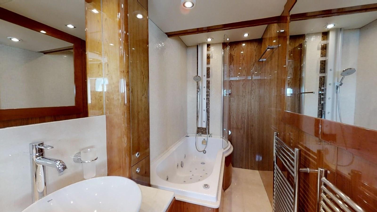 a bathroom with a tub sink and shower aboard WHITE PEARL I Yacht for Sale