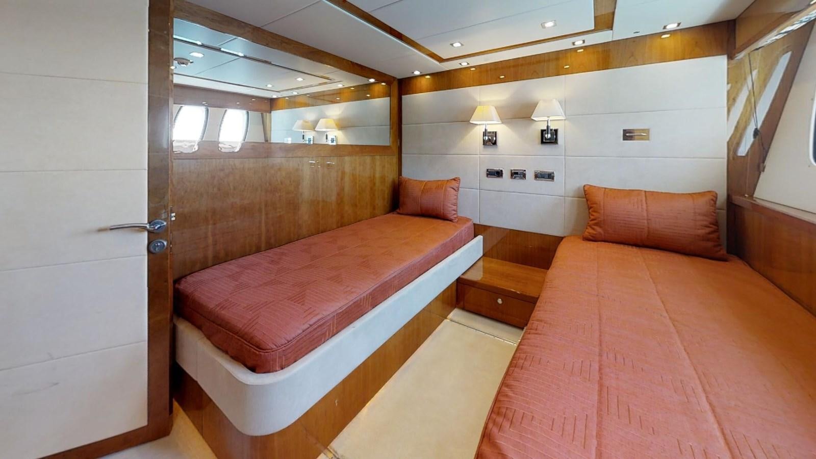 a room with a bed and a couch aboard WHITE PEARL I Yacht for Sale