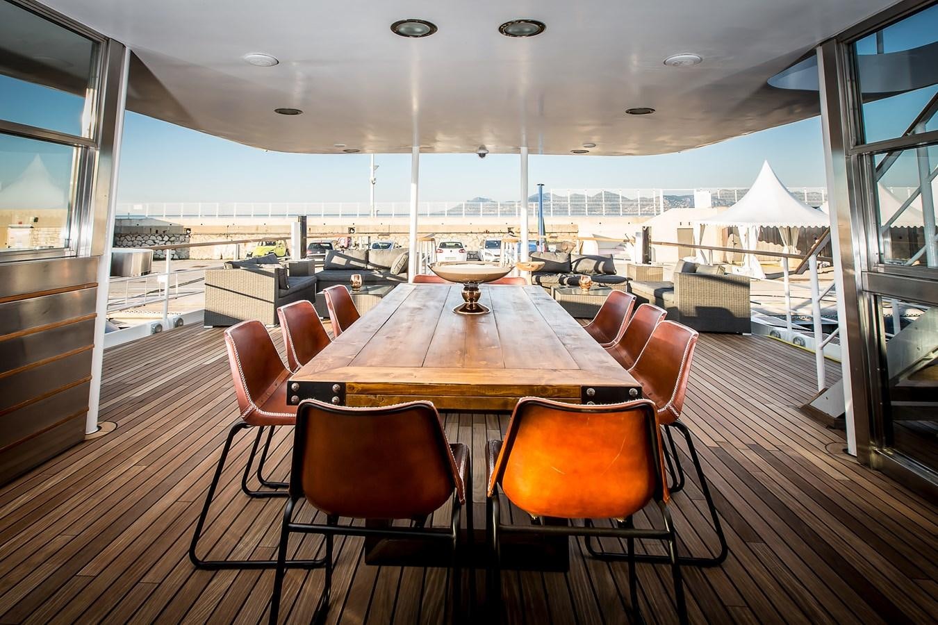 a room with a table and chairs aboard ALTER EGO Yacht for Sale