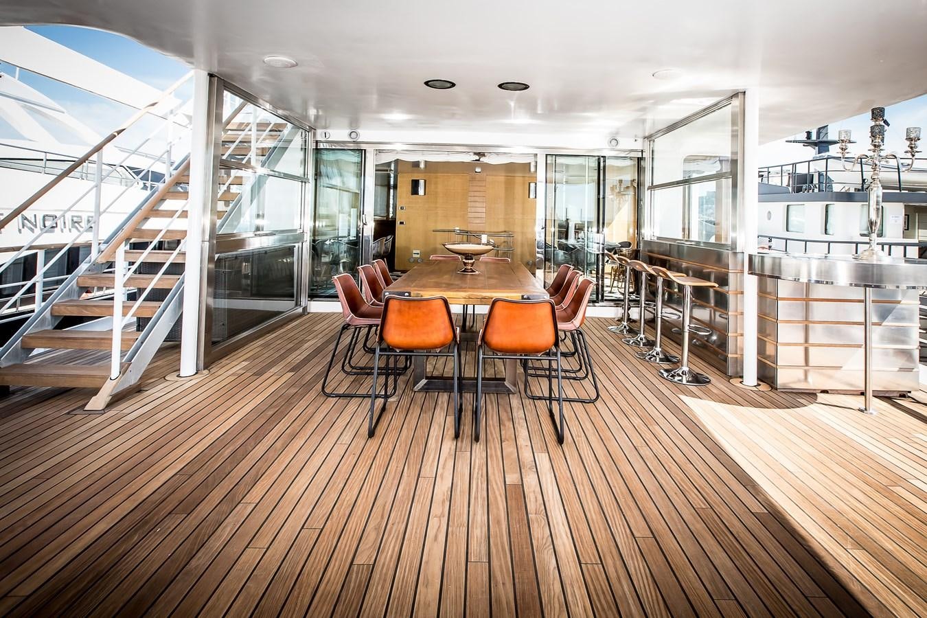 a room with a table and chairs aboard ALTER EGO Yacht for Sale