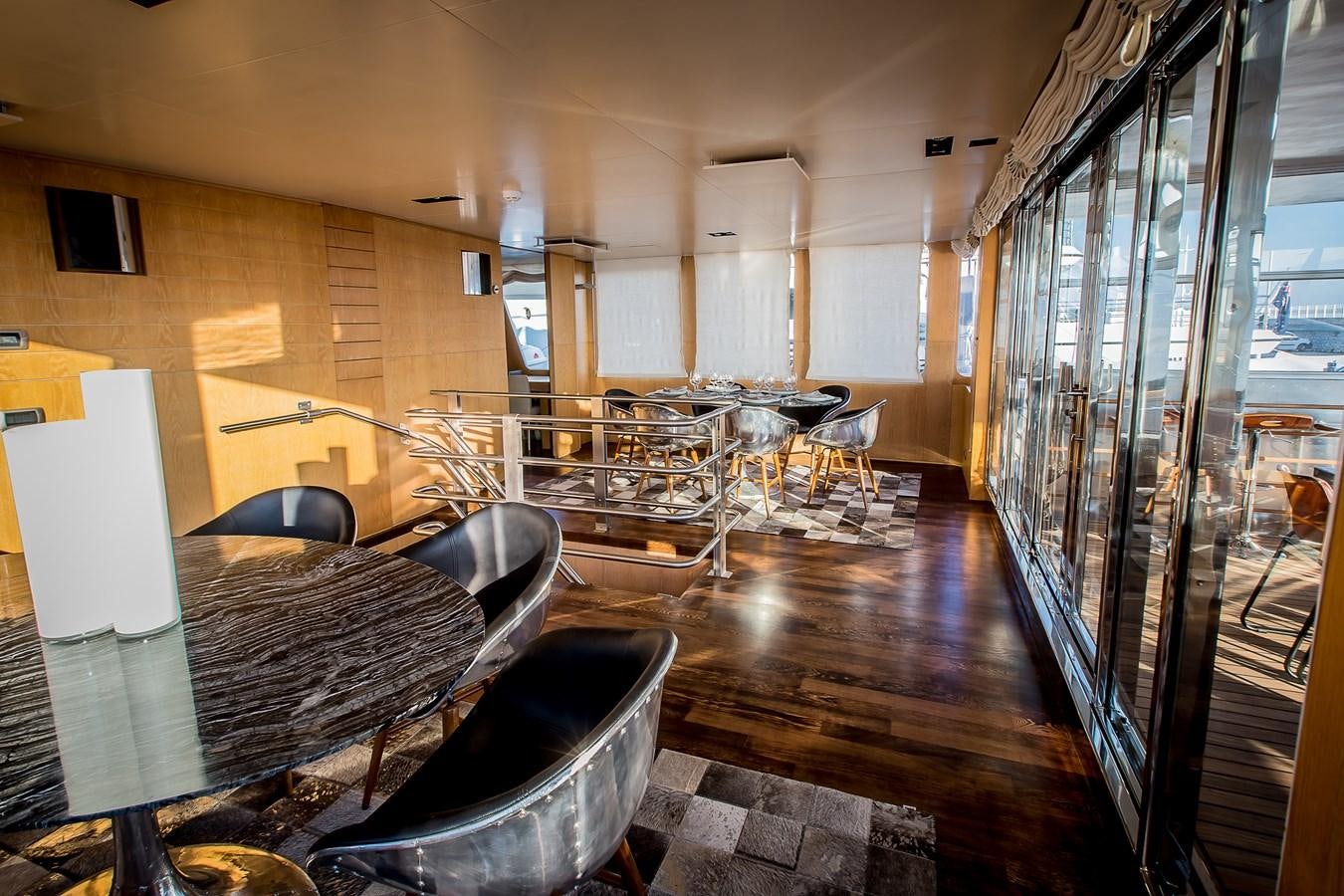 a room with a table and chairs aboard ALTER EGO Yacht for Sale