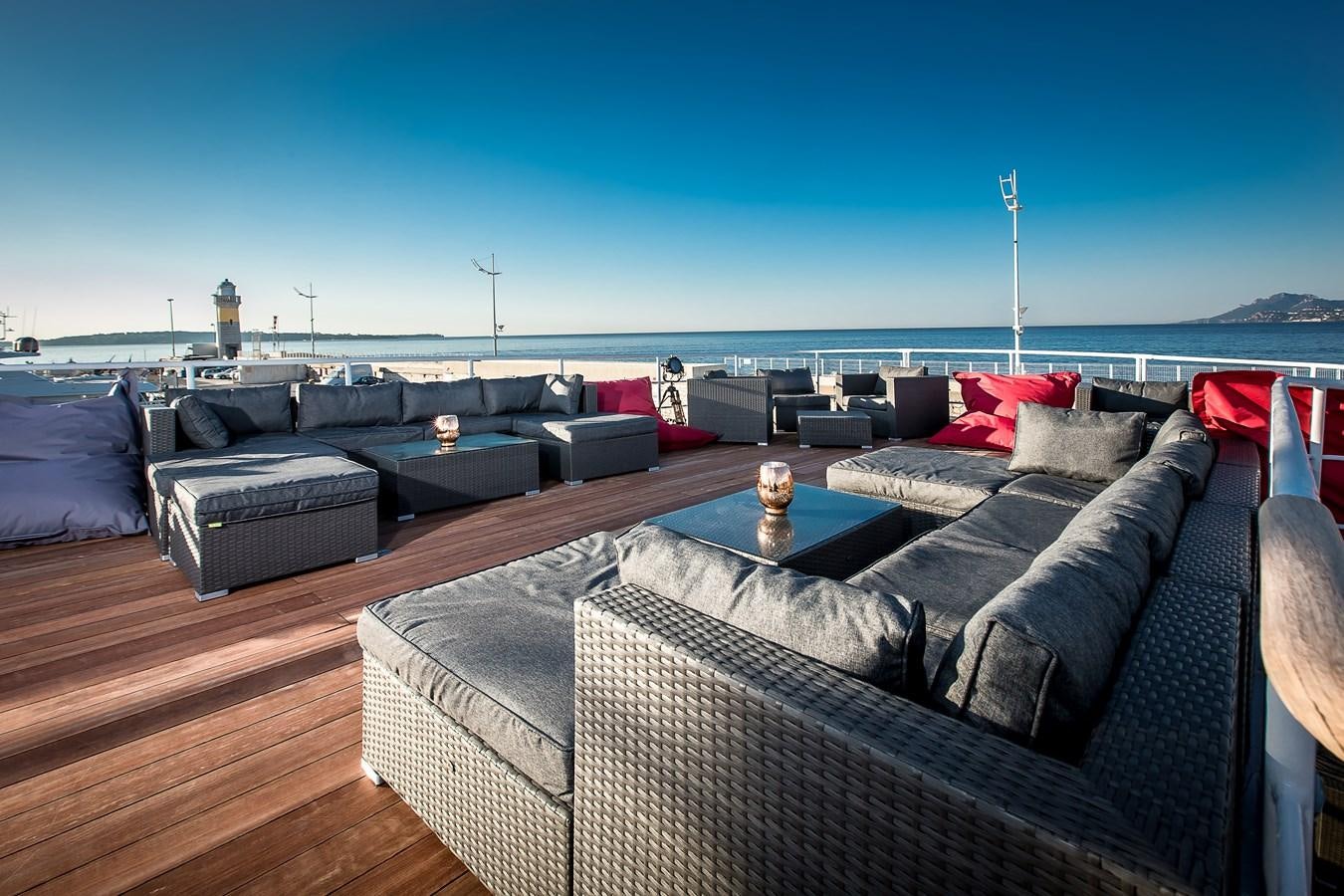 a deck with couches and pillows aboard ALTER EGO Yacht for Sale