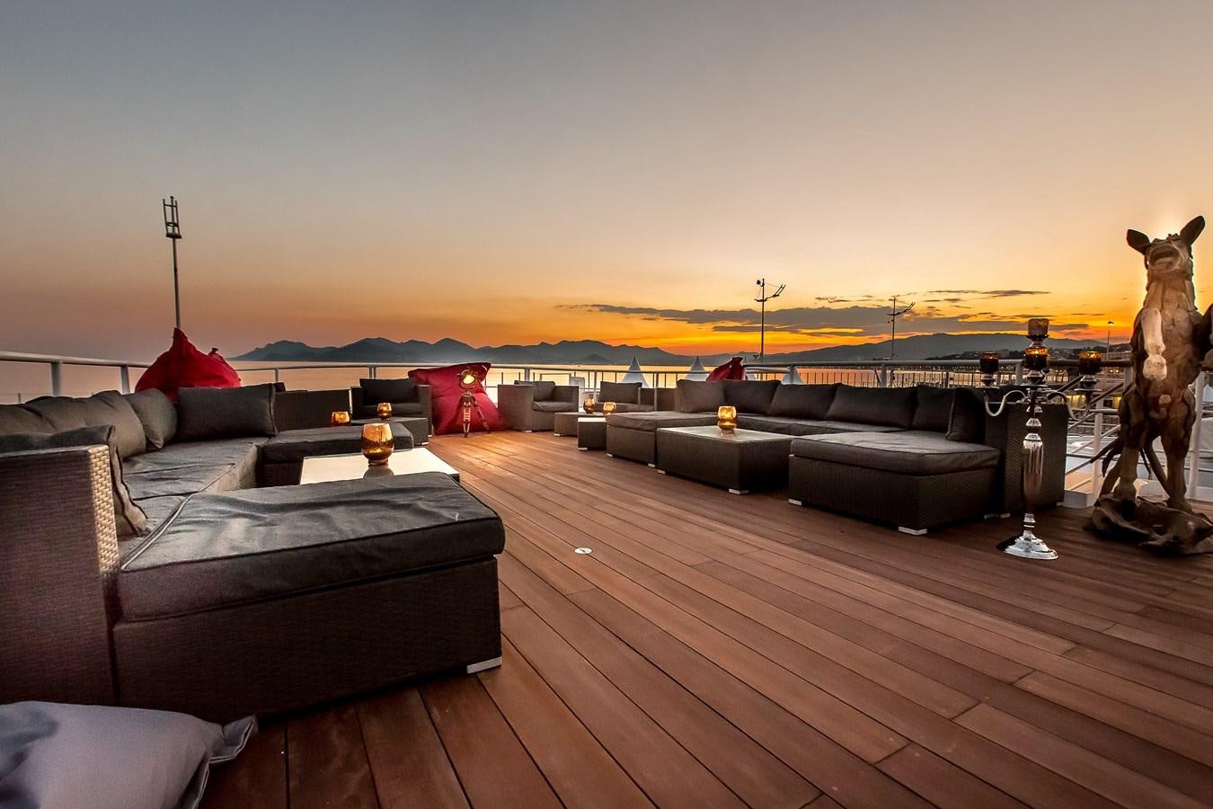 a deck with a large body of water and a statue of a bear aboard ALTER EGO Yacht for Sale