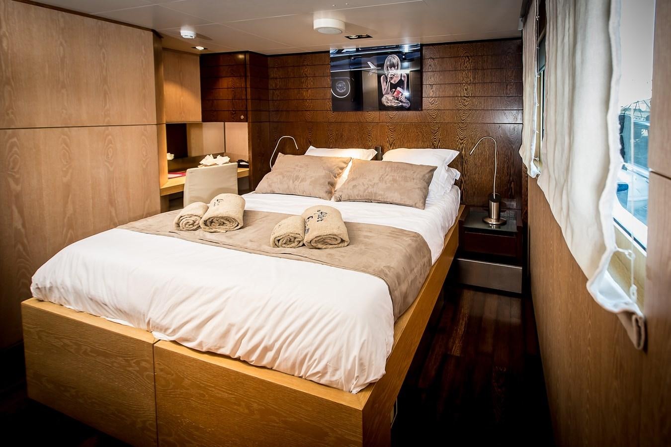 a bed with white sheets aboard ALTER EGO Yacht for Sale
