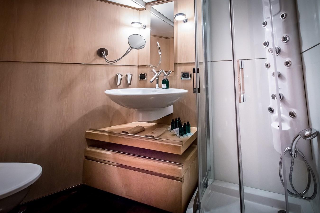 a bathroom with a sink and a shower aboard ALTER EGO Yacht for Sale