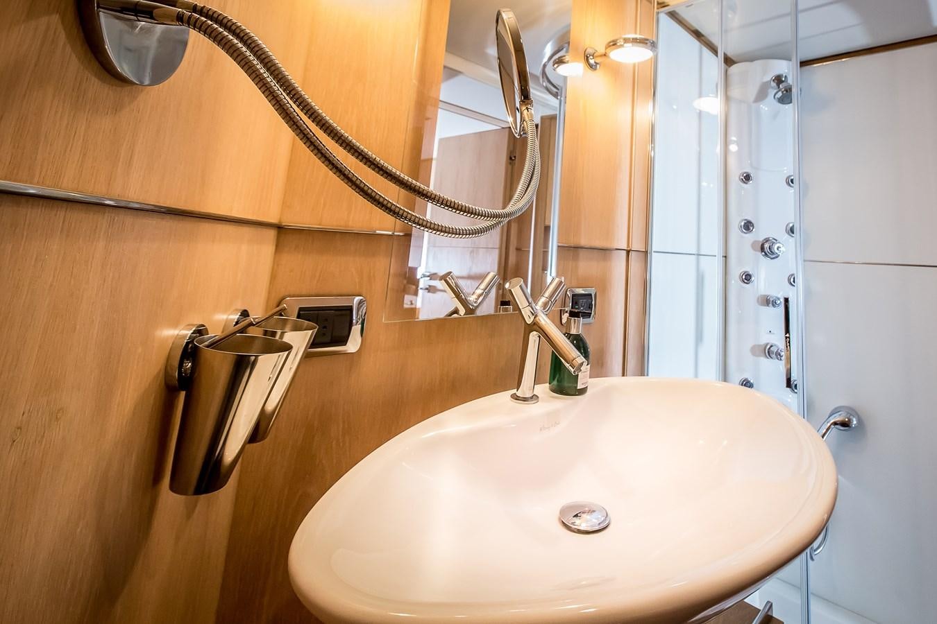 a bathroom with a sink and a mirror aboard ALTER EGO Yacht for Sale