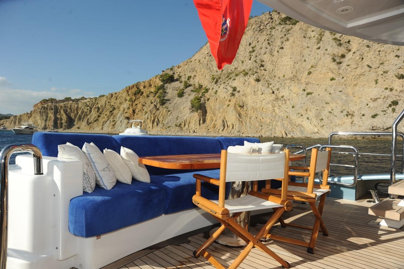 a table and chairs on a deck aboard BENITA BLUE Yacht for Sale