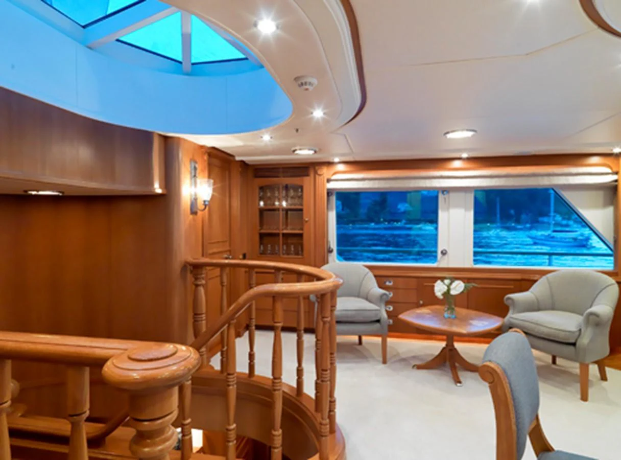 a room with a table chairs and a window aboard SPADA Yacht for Sale