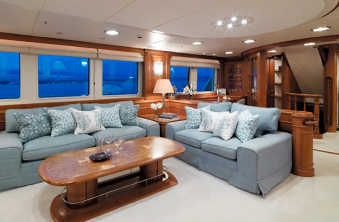 a living room with a couch and a table aboard SPADA Yacht for Sale