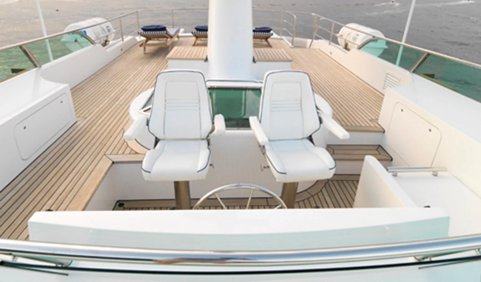 a white chair on a deck aboard SPADA Yacht for Sale