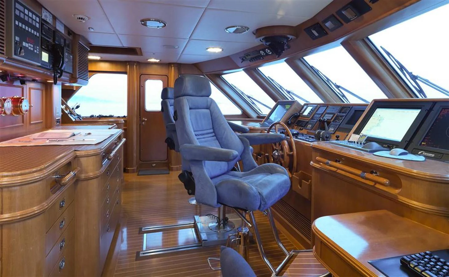inside of a vehicle with desks and computers aboard SPADA Yacht for Sale