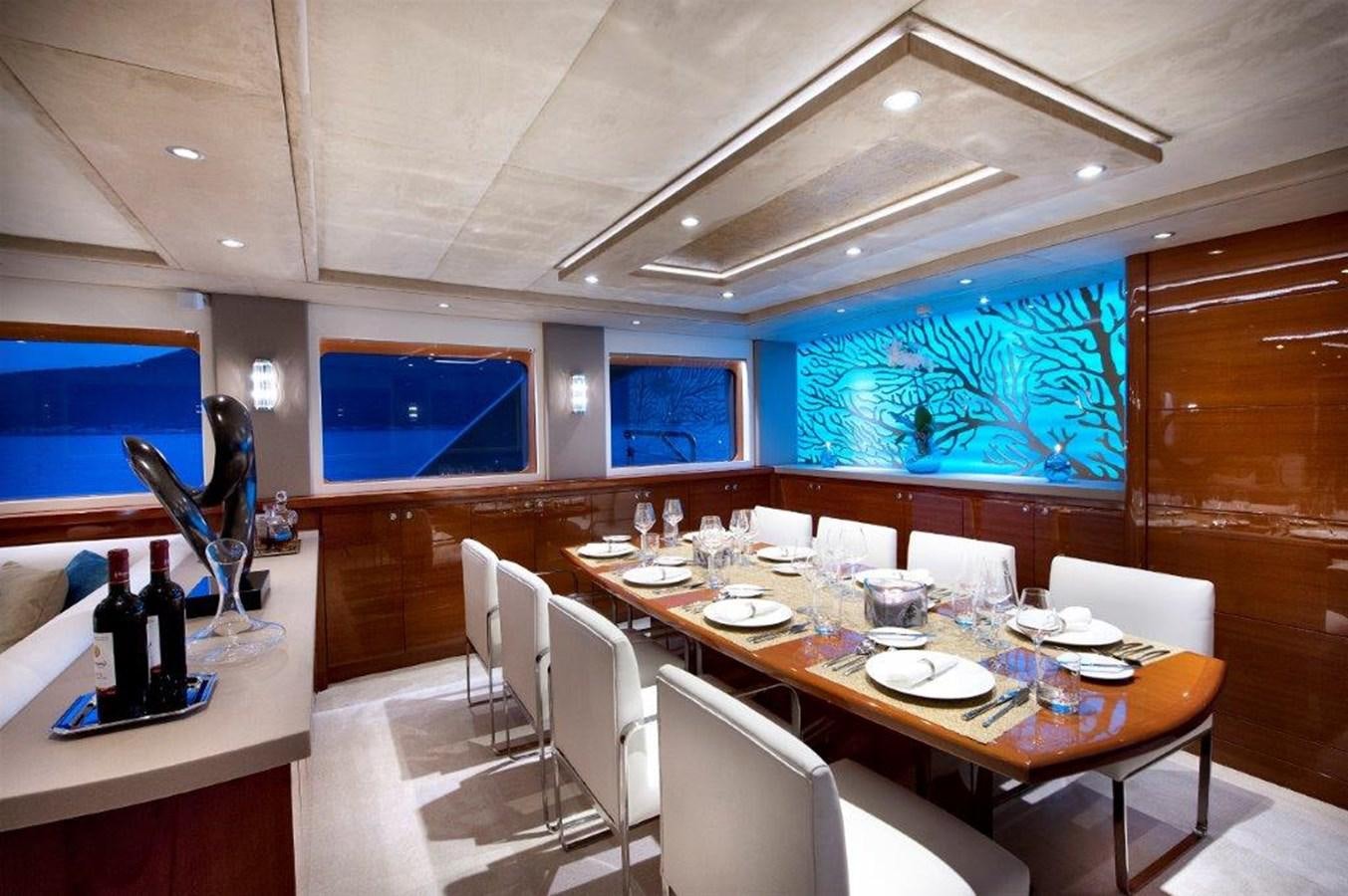 a room with a table and chairs aboard MERMAID Yacht for Sale