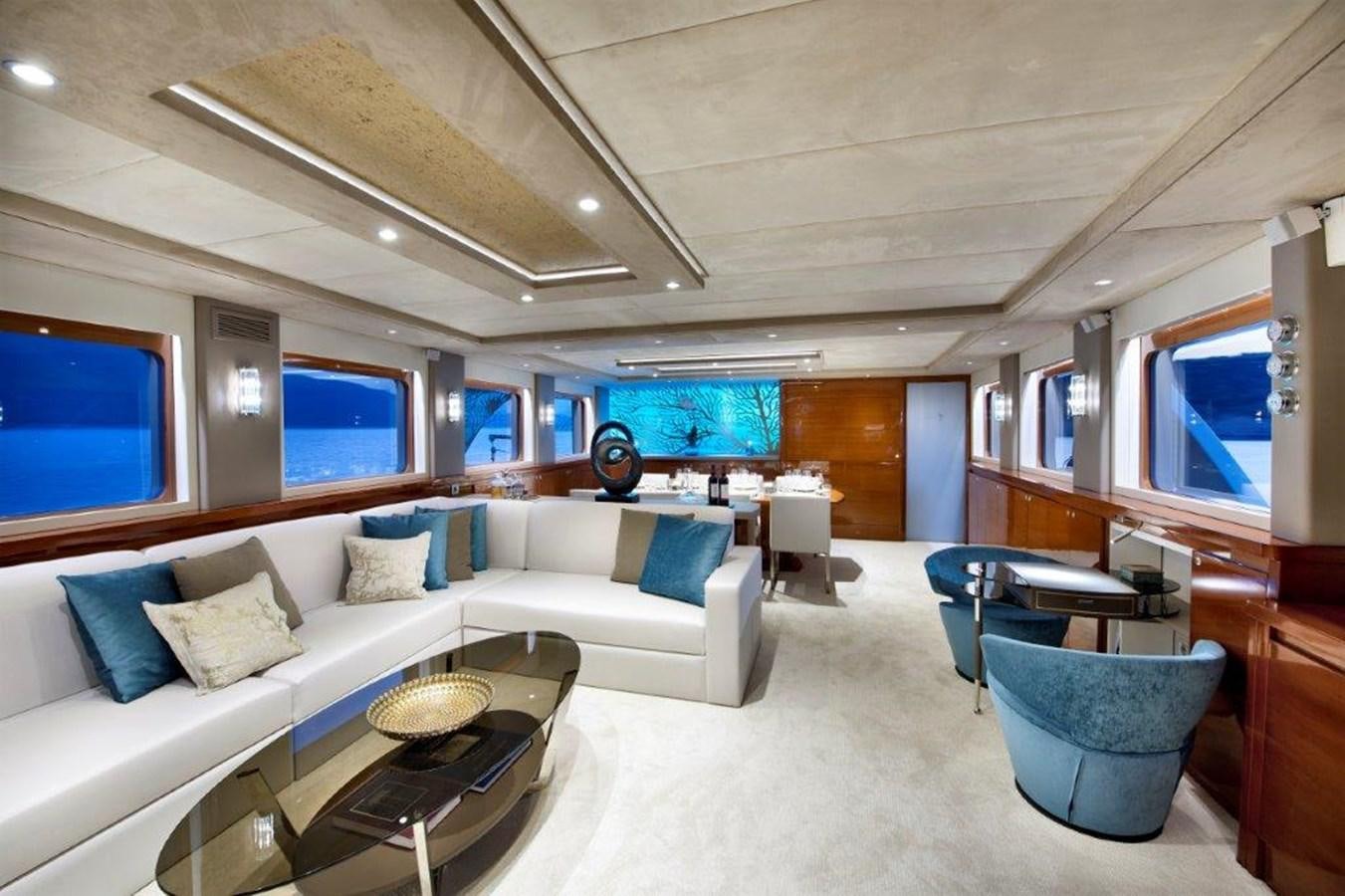 a living room with a couch and a table aboard MERMAID Yacht for Sale