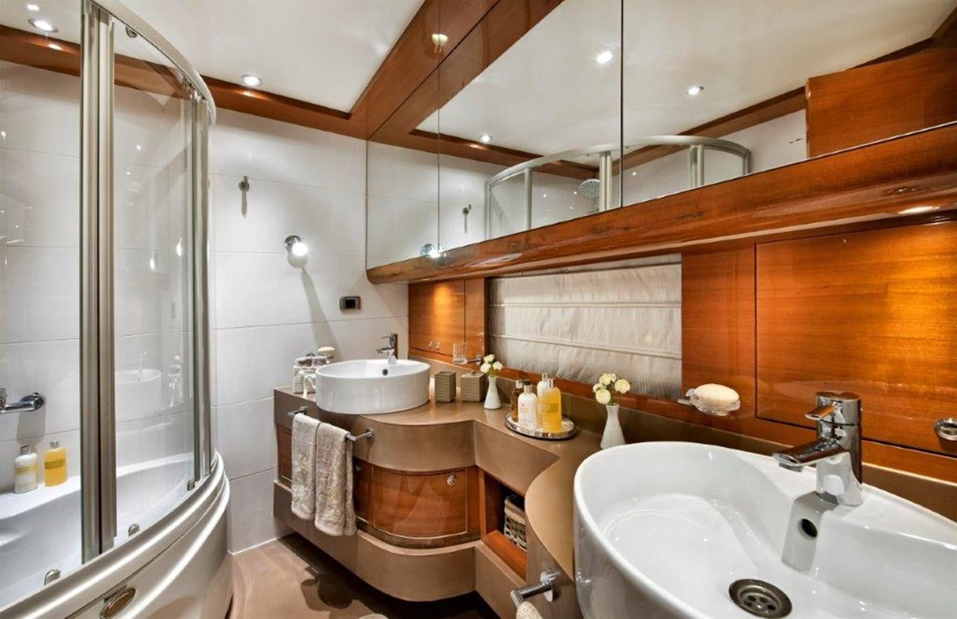 a bathroom with a shower and sink aboard MERMAID Yacht for Sale