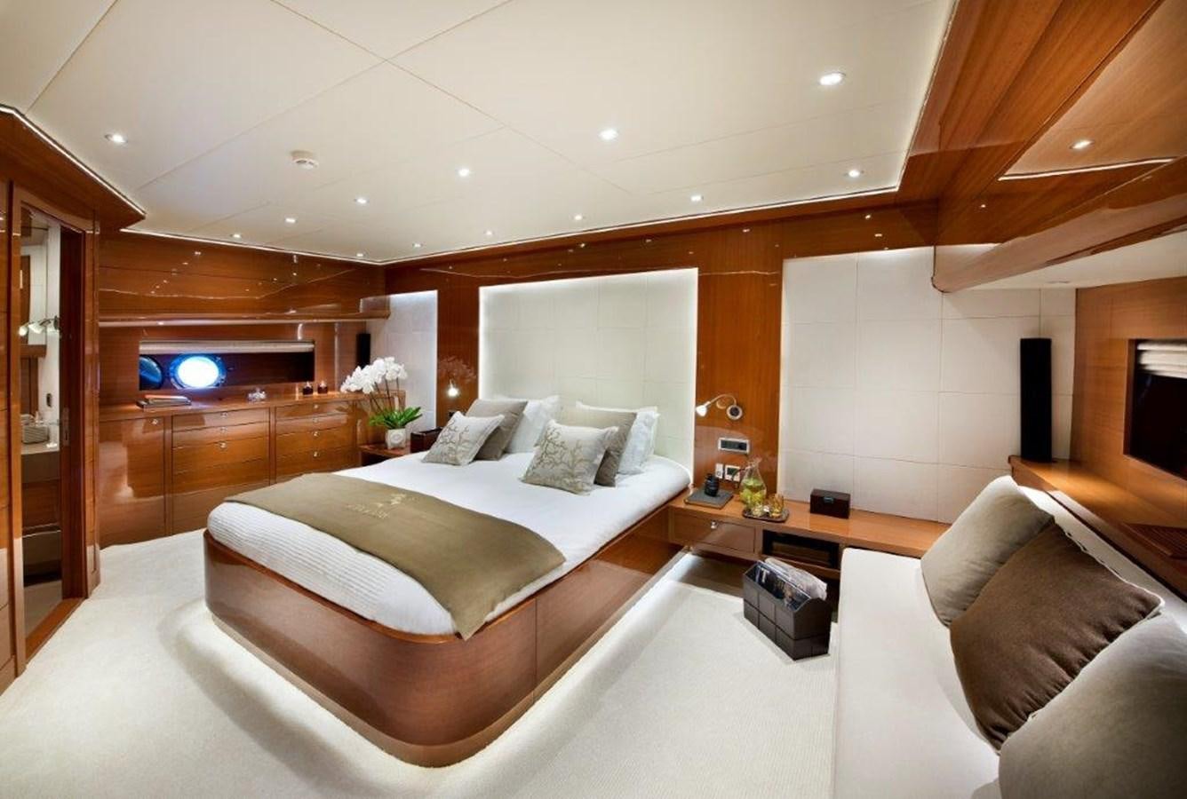 a large bedroom with a bed aboard MERMAID Yacht for Sale