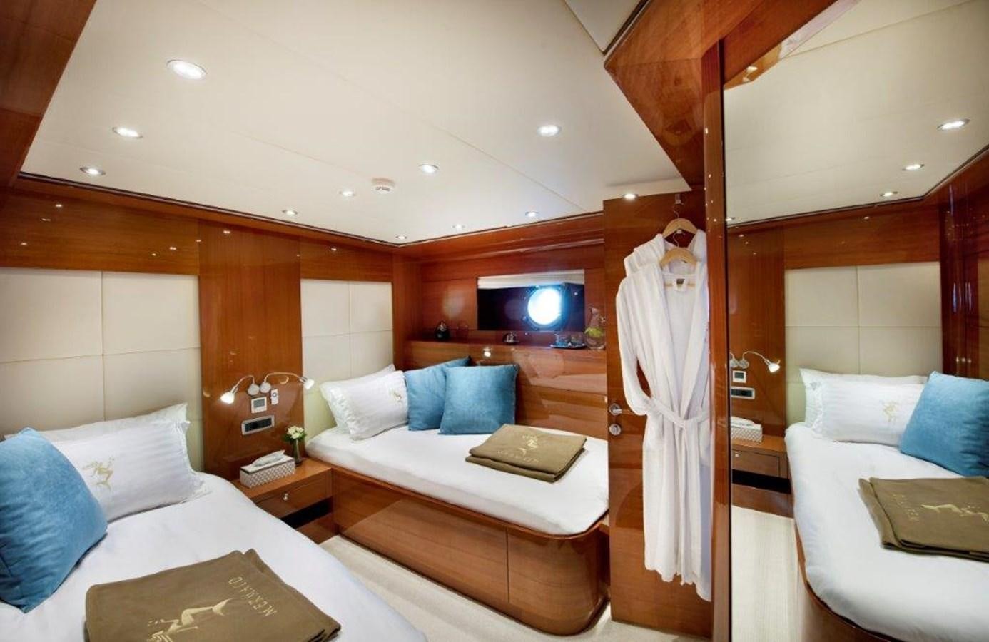 a room with a bed and a television aboard MERMAID Yacht for Sale