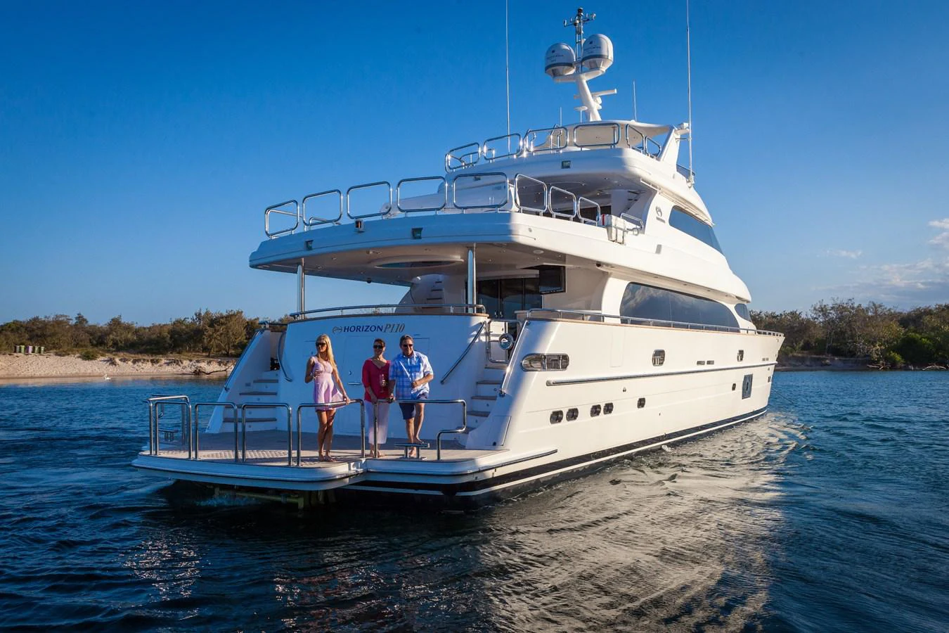 a group of people standing on a boat in the water aboard P110 (NEW BOAT SPEC) Yacht for Sale