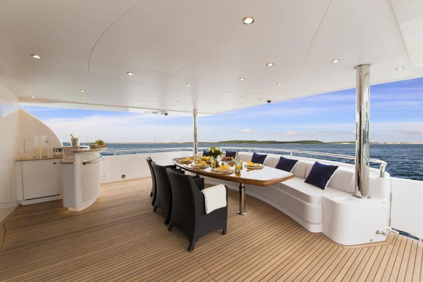 a room with a table and chairs aboard P110 (NEW BOAT SPEC) Yacht for Sale