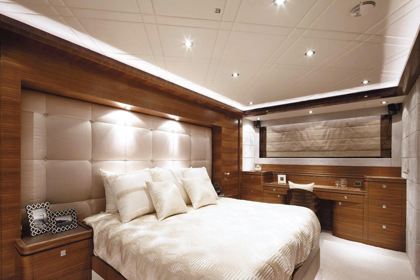 a room with a bed and a dresser aboard P110 (NEW BOAT SPEC) Yacht for Sale