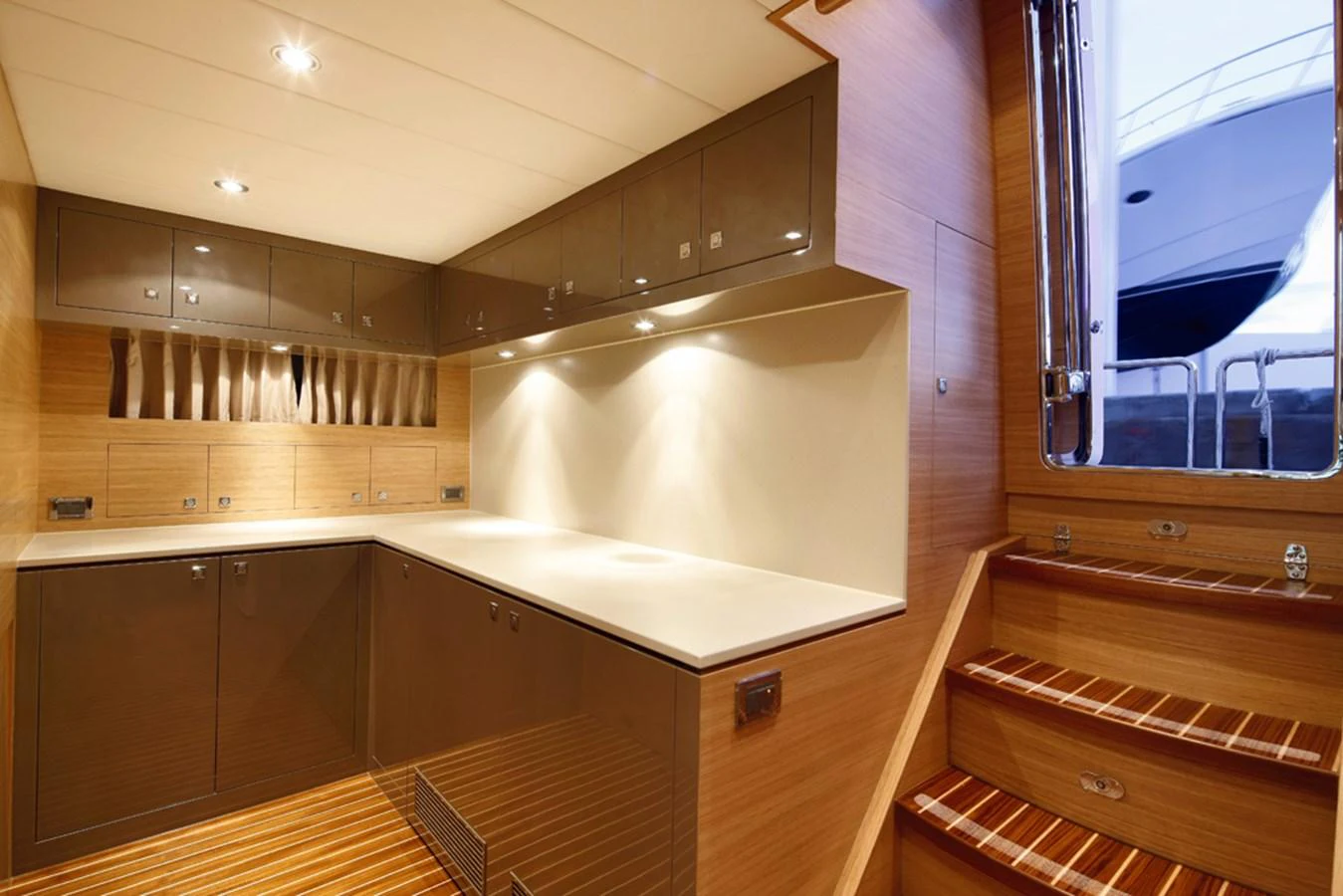 a kitchen with wooden cabinets aboard P110 (NEW BOAT SPEC) Yacht for Sale